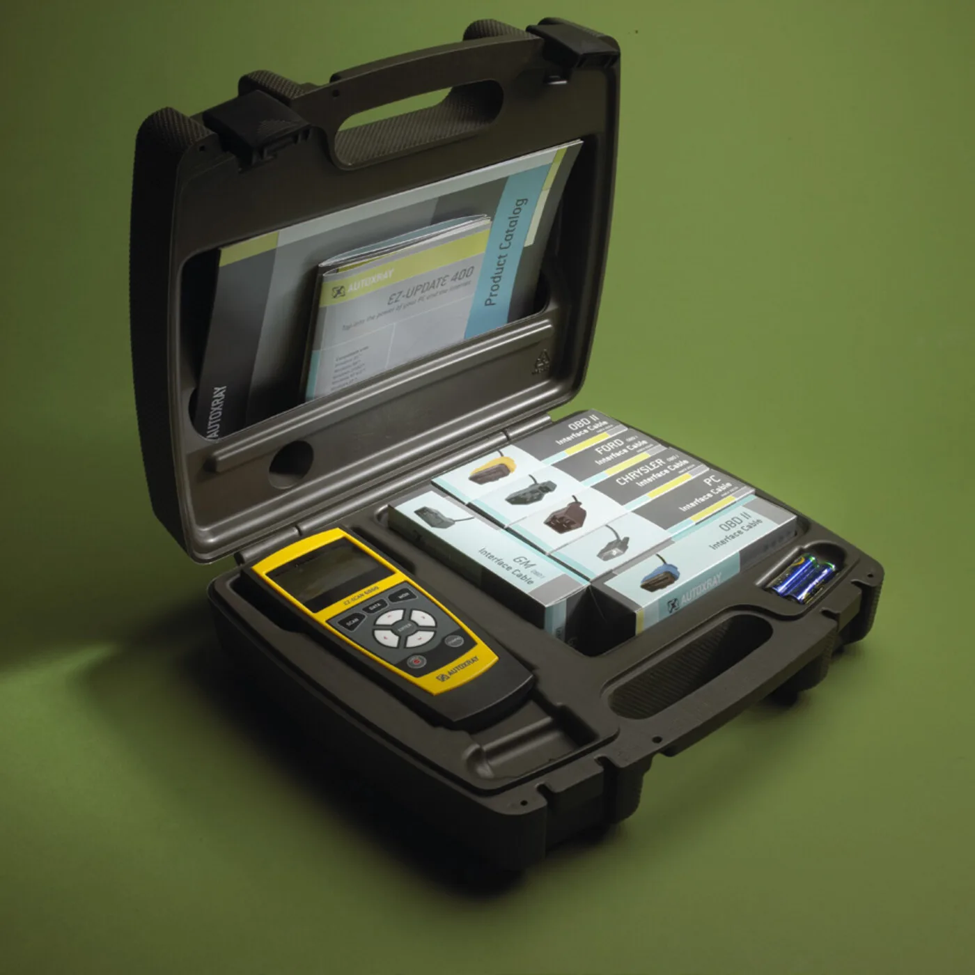 AutoXray EZ-Scan 3000 diagnostic scanner — yellow-handled tool inside open kit case with documentation