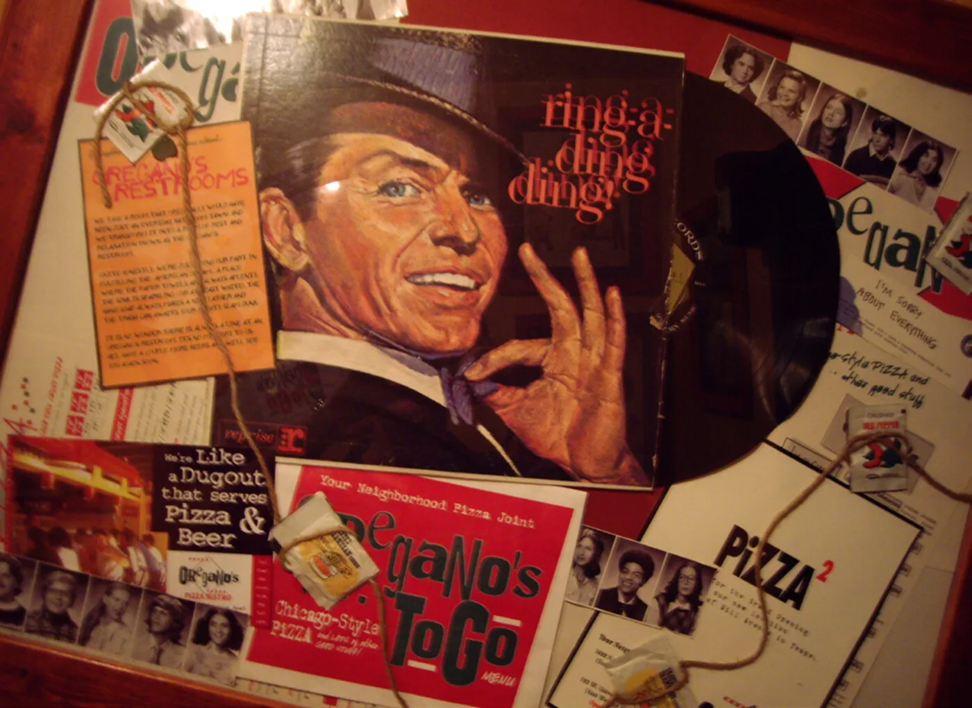 Oregano's record-album-style menu — vinyl sleeve graphic with Frank Sinatra and stacked menu inserts